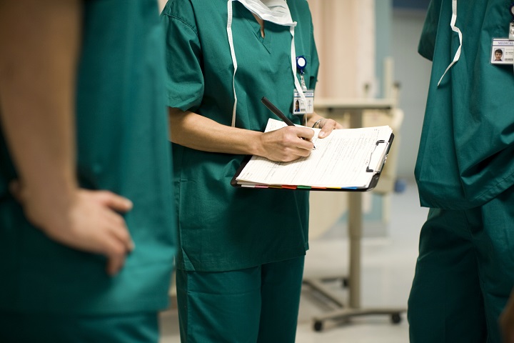 Medical staff holding a clipboard