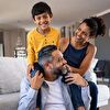 Boy Sitting in Father’s Neck, Mother Smiling