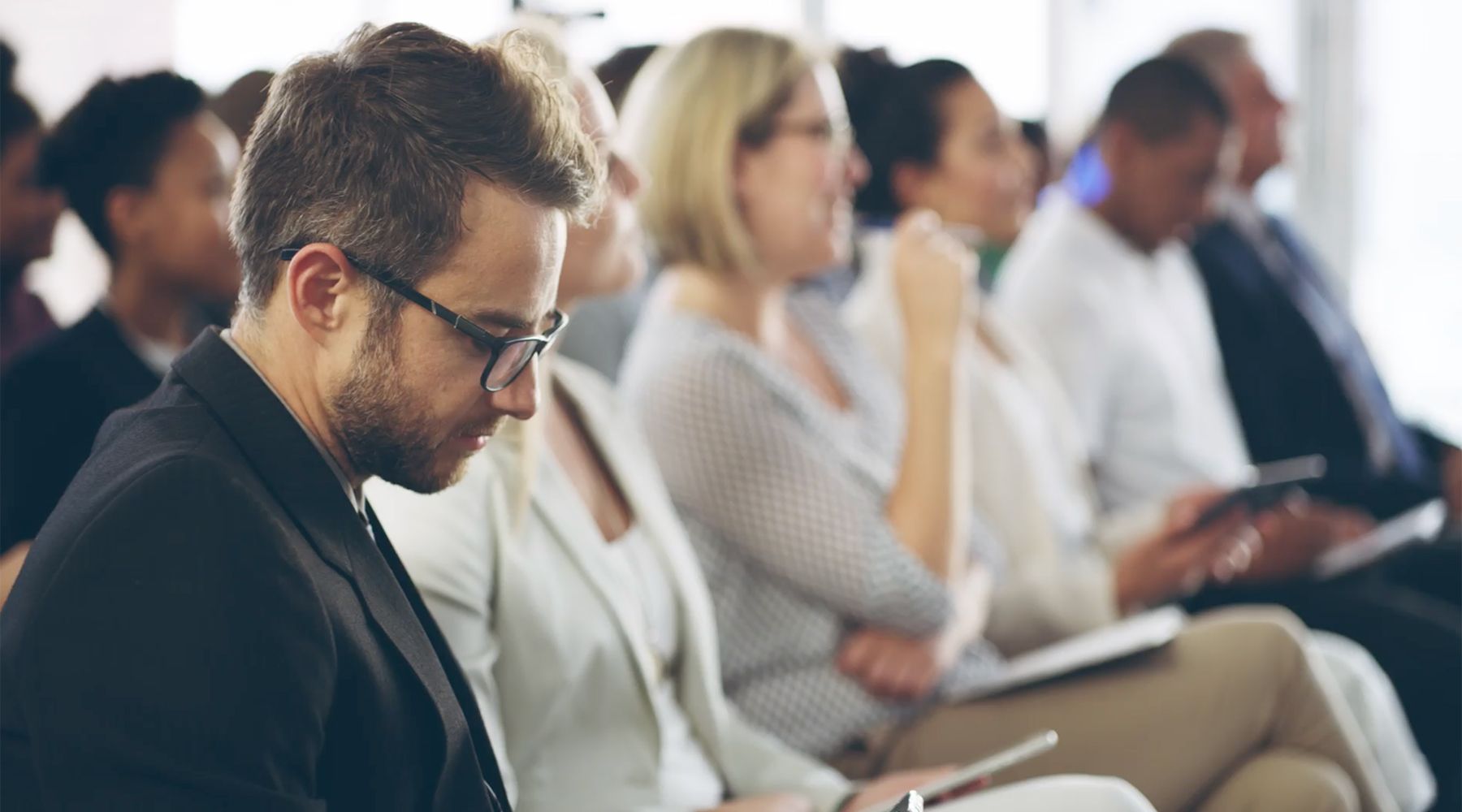 Image of reporters and other citizens attending a meeting.