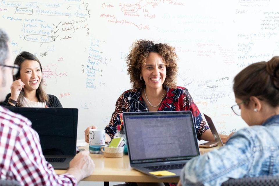 UCSF community mebers gatered around a conference table