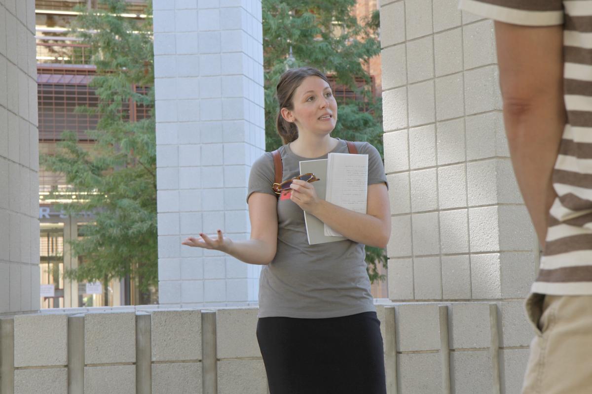 A student guides a Landmarks tour group