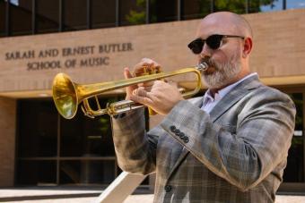 UT alumni and leader of the UT Jazz Trumpet Studio Dr. Michael Sailors performs an excerpt from his new album outside of the Butler School of Music on Sept. 9, 2024.