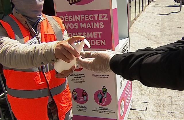 Person getting hand sanitised