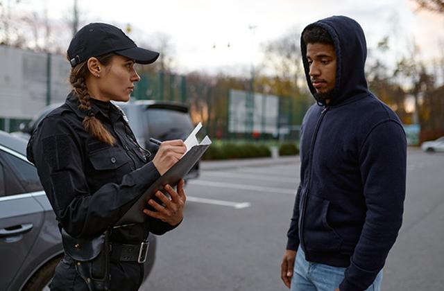 Upset man and police woman issuing fine