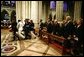 President George W. Bush and Laura Bush, Vice President Dick Cheney and Lynne Cheney, along with four former US Presidents, and other world dignitaries watch as the casket of former President Ronald Reagan is carried into the National Cathedral in Washington, D.C., Friday, June 11, 2004.  White House photo by David Bohrer