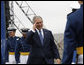 President George W. Bush salutes a graduate of the United States Air Force Academy during commencement exercises Wednesday, May 28, 2008, in Colorado Springs. Speaking to the 1,012 graduating cadets, the President said, "Each of you gathered here this morning has answered that same call. I want to thank you for stepping forward to serve. The security of our citizens and the peace of the world will soon be in your hands -- the best of hands. Be officers of character and integrity. Keep your wings level and true. Never falter; do not fail. And always know that America stands behind you." White House photo by Eric Draper