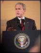 President George W. Bush gestures as he delivers remarks at the Queen Sirikit National Convention Center Thursday, August 7, 2008, in the Bangkok.  White House photo by Chris Greenberg