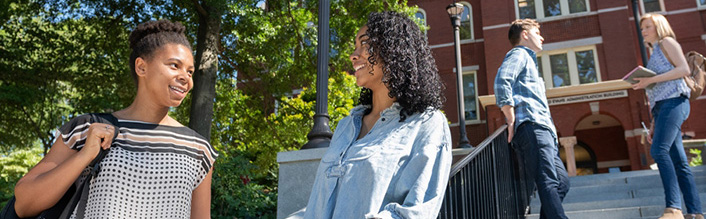 Students standing on building steps on Tech campus