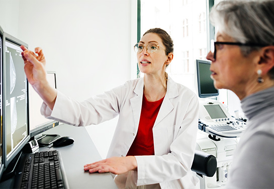 Doctor and patient looking at an image on a computer screen