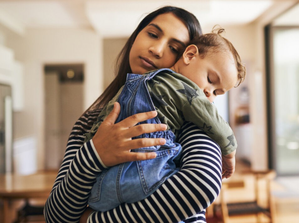 child being held by mother