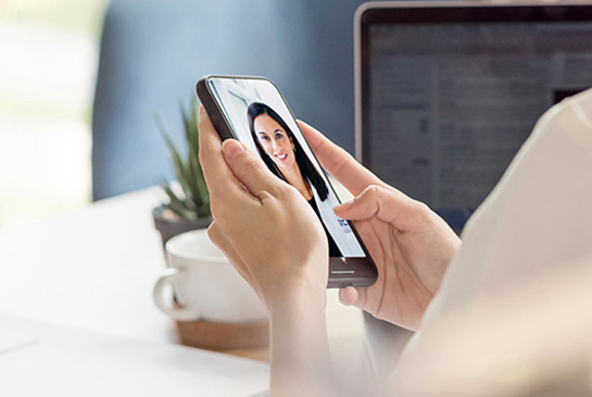 Patient speaking with their doctor via a telehealth video visit