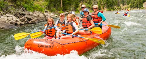 family on a whitewater rafting trip