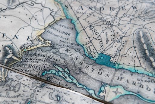 Detail of an engraved, colored map of Jamaica shows Kingston Harbor outlined in a greenish blue color and St. Andrew. Other surrounding locations labeled in English.