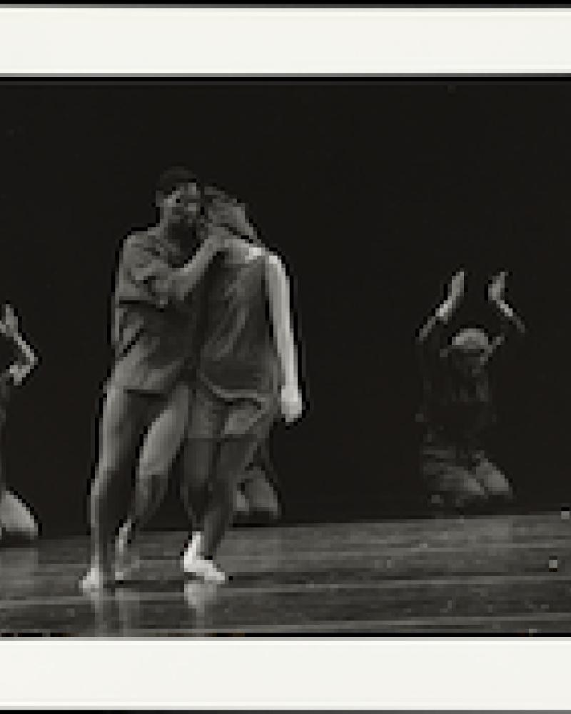 Five dancers on a stage, black and white photograph