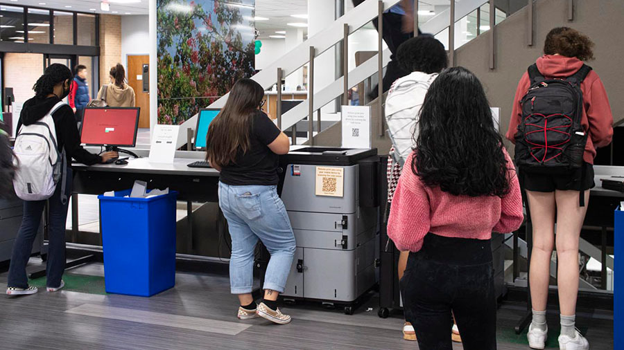 two students at a printer