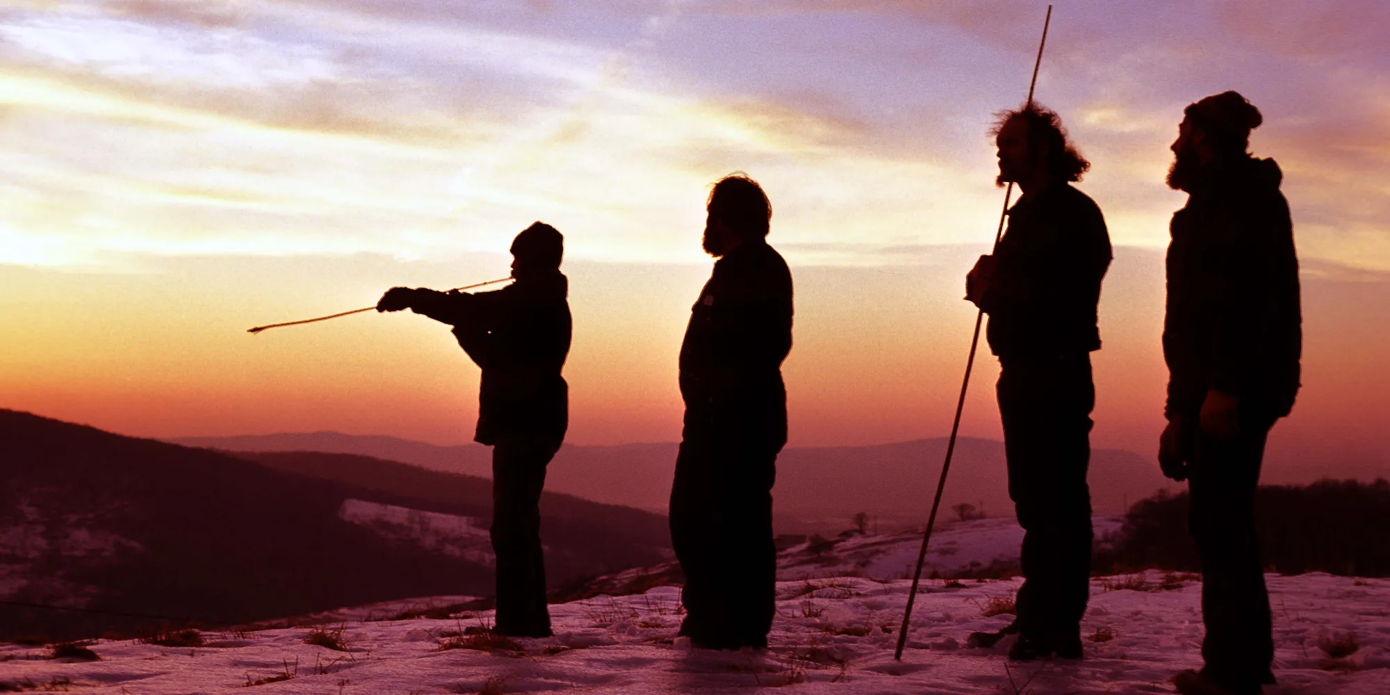 Dennis Stanford and other anthropologists practicing the use of atlatls in the sunset