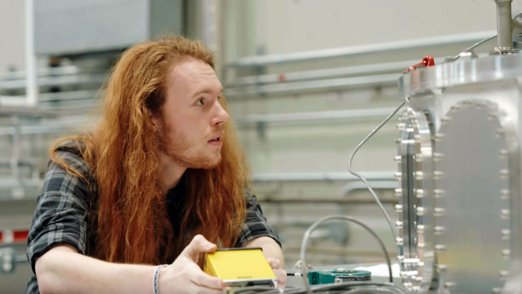 scientist in the lab holding a controller