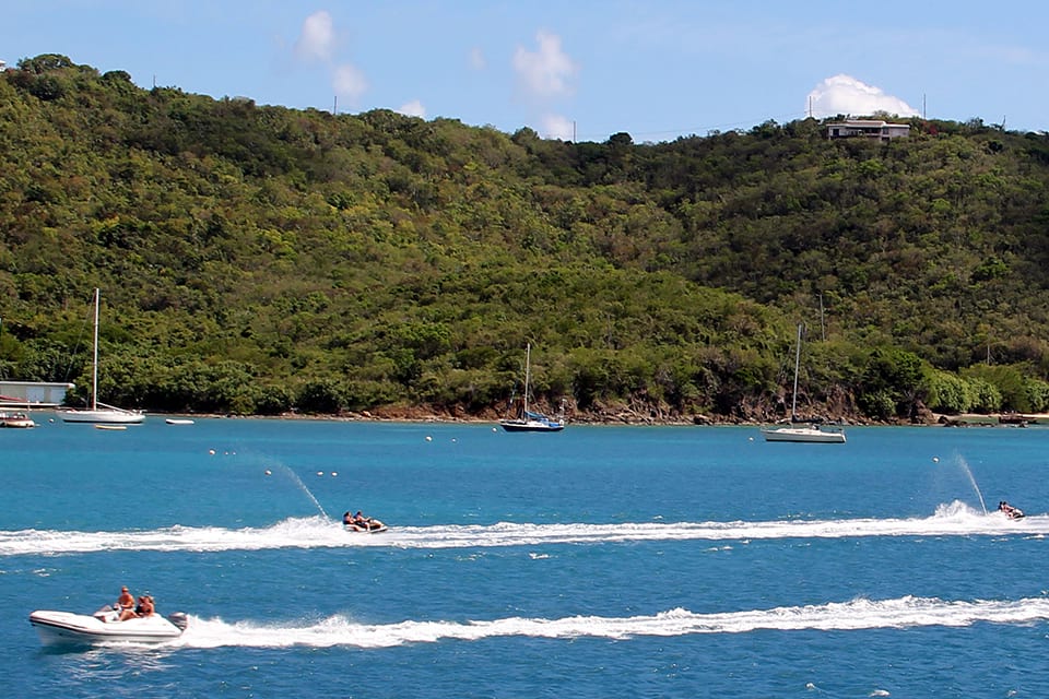 recreational boaters and jet skiers enjoying a nice day on the water