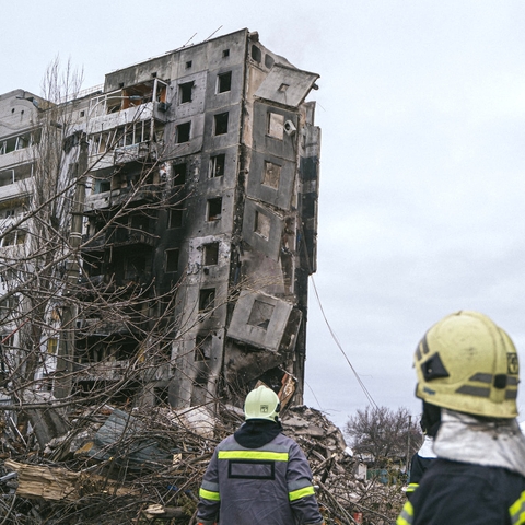 Emergency servicemen and volunteers remove rubble and demine territory after Russian shelling, Kyiv, Oblast, 2022.