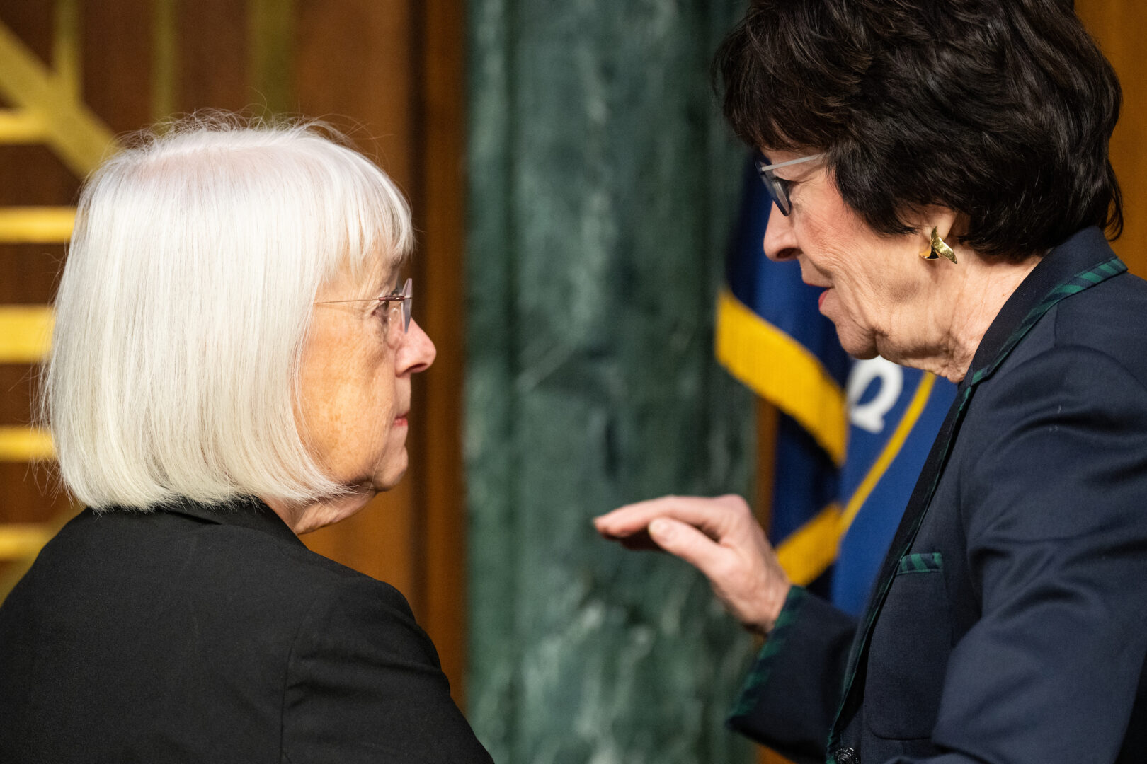 Senate Appropriations Chair Patty Murray, D-Wash., left, speaks with ranking member Sen. Susan Collins, R-Maine, before a hearing on Nov. 8, 2023. 