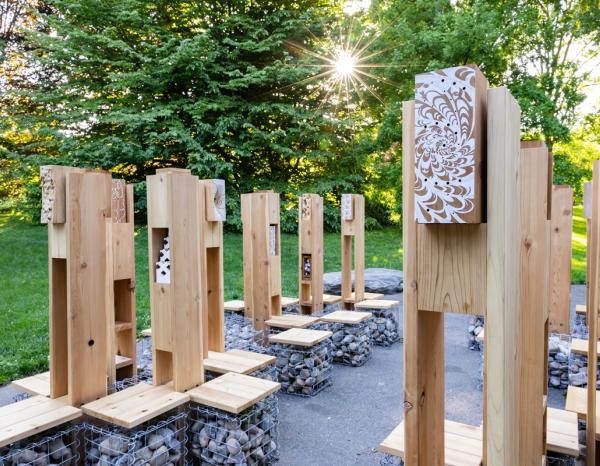 Pollinator Lounge structure seen in the Brooklyn Botanical Gardens in early evening