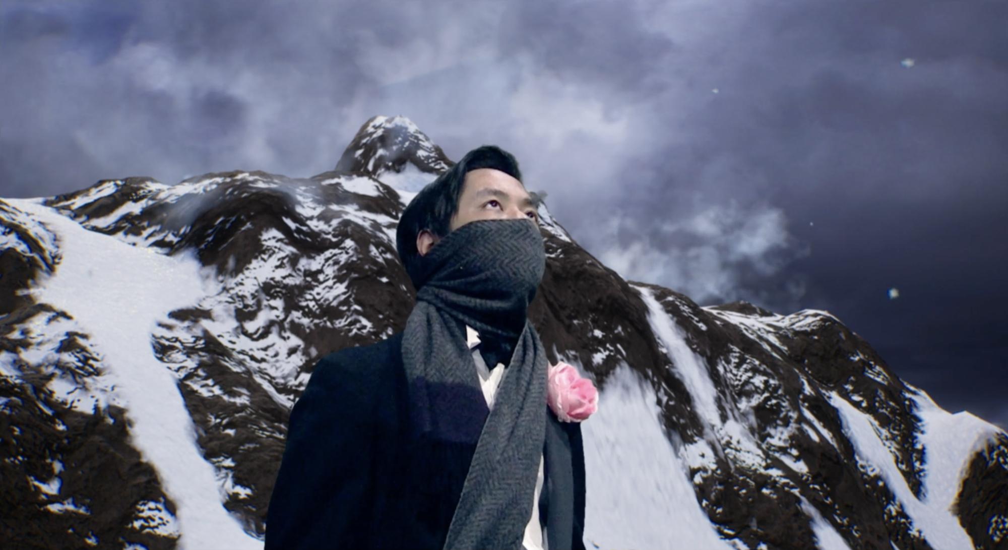 man with a scarf wrapped around his mouth and nose looks up, with an icy Antarctic background behind him