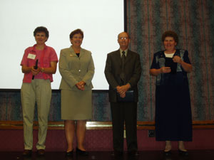 Archival photo of founders of Women in Agriculture on stage.