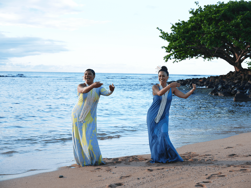 Women dancing on the beach