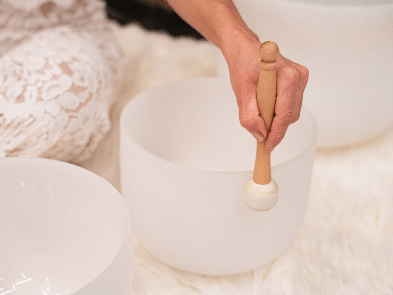 Person using a singing bowl