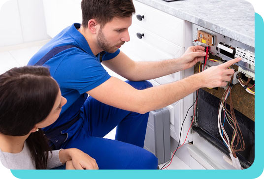 Repairman fixing dishwasher