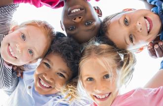 smiling kids looking looking at camera