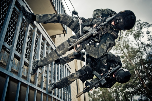 Two AFP TR  officers roping down a building