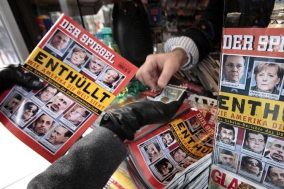 A customer buys the German Der Spiegel magazine at a kiosk in Hamburg