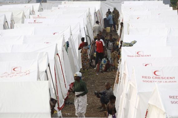 Congolese refugees displaced by fighting between the Congo army and rebel group Allied Democratic Forces (ADF) last week walk through Bukanga transit camp