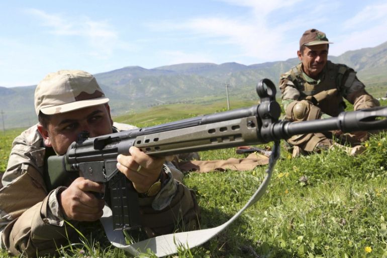 Member of Kurdish peshmerga forces holds a rifle during a training session at a training camp on the outskirts of Dohuk province