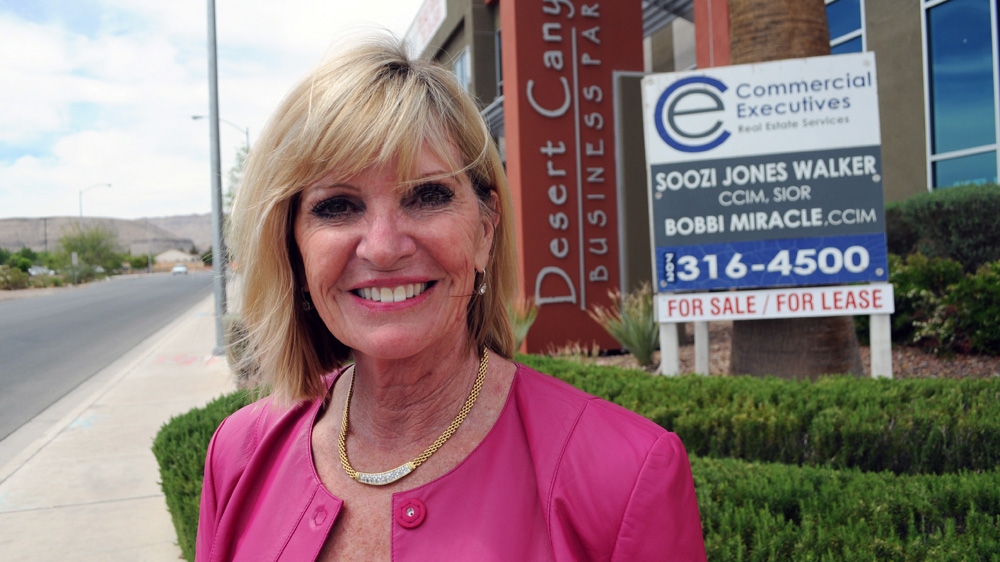 Soozi Walker Jones stands in front of Desert Canyon, one of the last office developments to be completed in Las Vegas' southwest suburbs before the Great Recession [Joe Jackson/Al Jazeera]