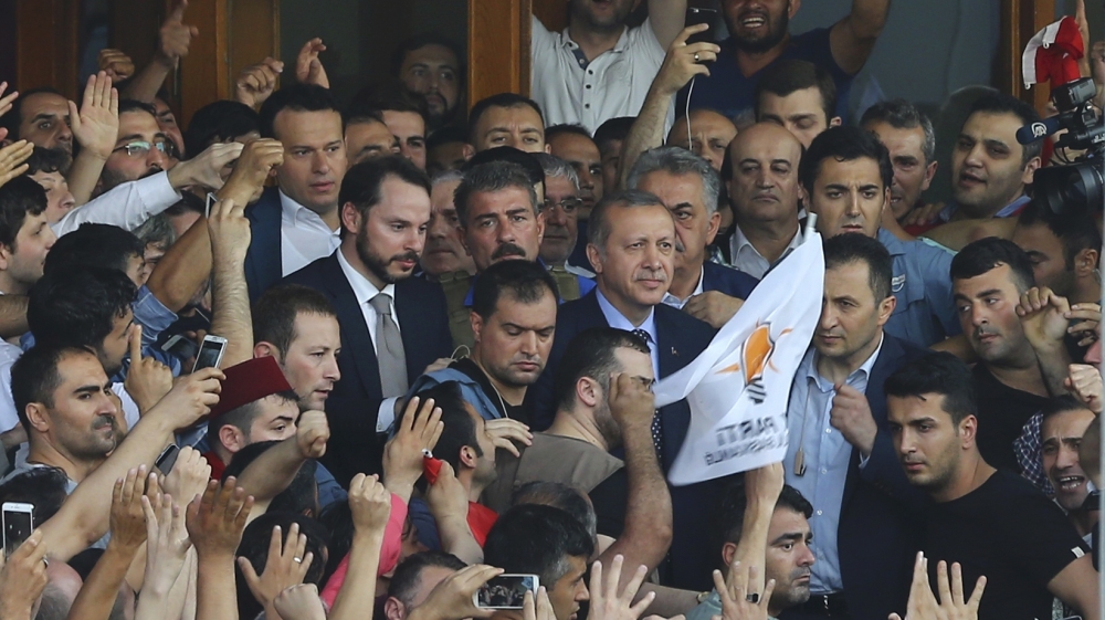 Erdogan surrounded by supporters at the Ataturk Airport in Istanbul [Huseyin Aldemir/Reuters]