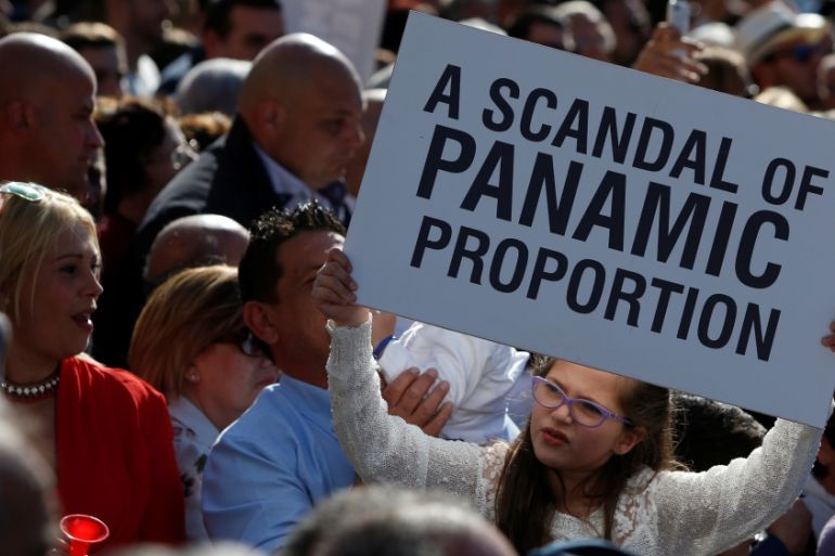 Protestors take part in a national protest against the government of Prime Minister Joseph Muscat, in Valletta