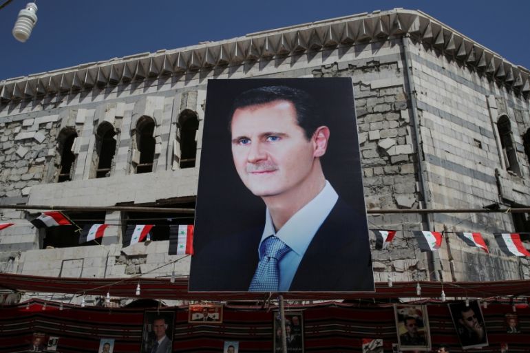 A banner depicting Bashar al-Assad