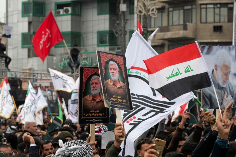 Supporters of Iraq's Hashed al-Shaabi political group rally in Baghdad on the second anniversary of the US assassination of General Qassem Soleimnai