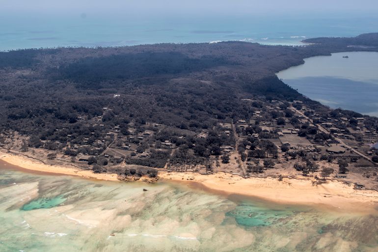 Ash covered homes and vegetation over Nomuka in Tonga