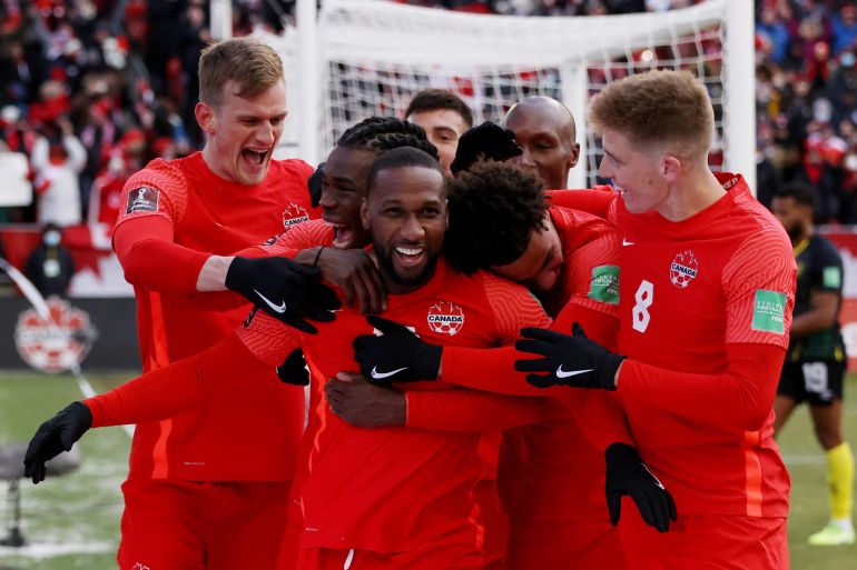 Canadian players in red celebrating