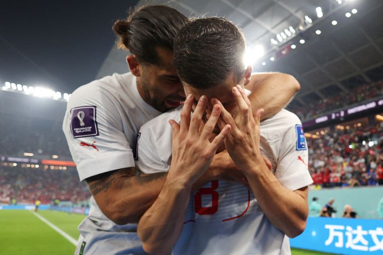 Soccer Football - FIFA World Cup Qatar 2022 - Group G - Serbia v Switzerland - Stadium 974, Doha, Qatar - December 2, 2022 Switzerland's Remo Freuler celebrates scoring their third goal with teammates with Ricardo Rodriguez REUTERS/Suhaib Salem TPX IMAGES OF THE DAY