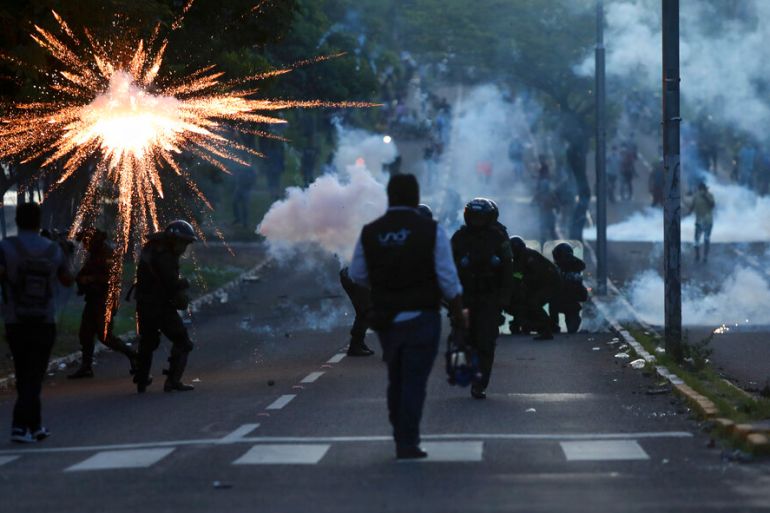 Police clash with supporters of Luis Fernando Camacho, governor of Santa Cruz, during a protest in Santa Cruz, Bolivia, on December 30, 2022 [Ipa Ibáñez/AP Photo]