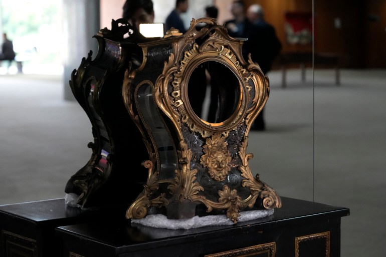 An ornate clock, broken with no clockface