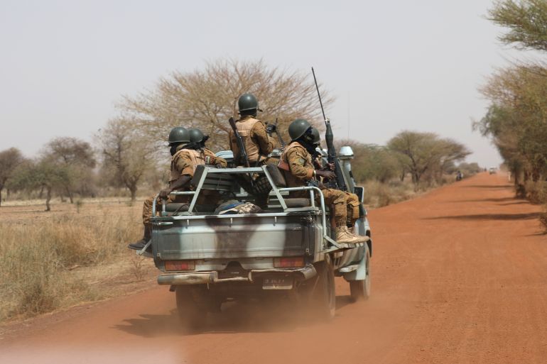 Soldiers from Burkina Faso patrol on the road of Gorgadji in sahel area, Burkina Faso