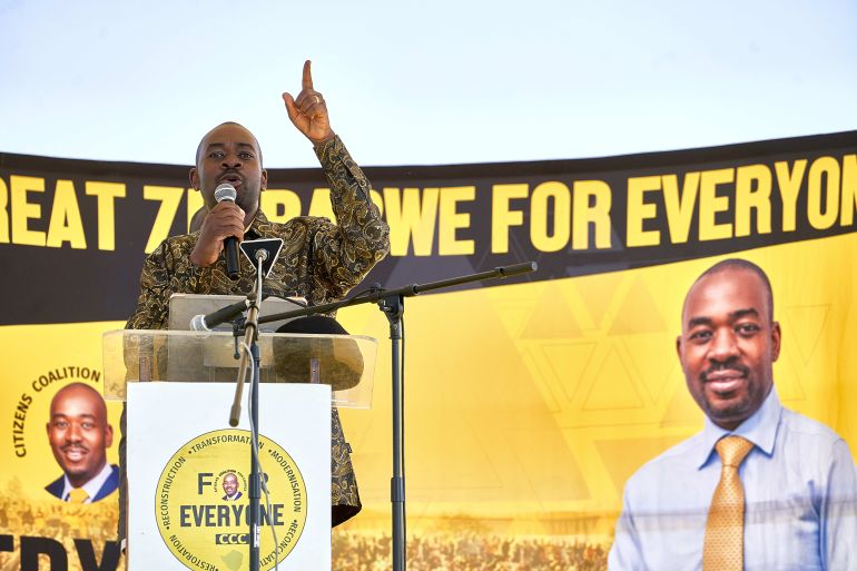 Nelson Chamisa, leader of the Citizen’s Coalition for Change (CCC), signals to the crowds with his finger, the party symbol, during a rally at White City Stadium in Bulawayo, Zimbabwe