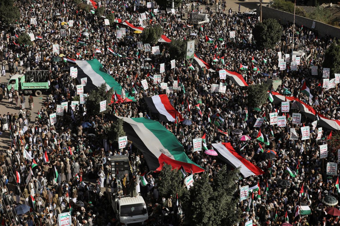 People rally to protest against the Israeli air strikes on the Gaza Strip, in Sanaa, Yemen