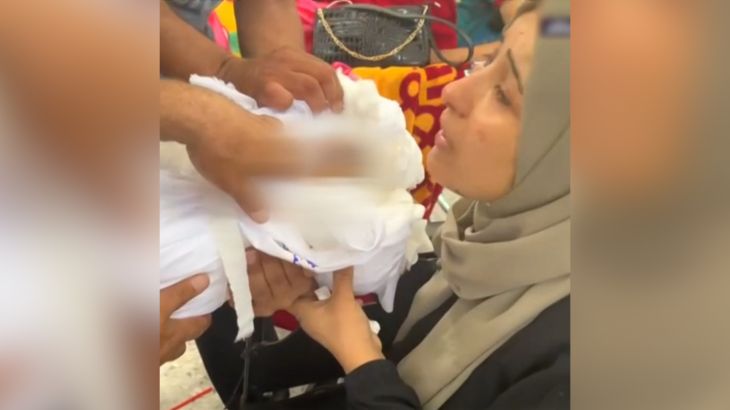 A Palestinian mother in Gaza gave a last kiss to her dead child who was killed in an Israeli air strike in Gaza.A Palestinian mother in Gaza gave a last kiss to her dead child who was killed in an Israeli air strike in Gaza.