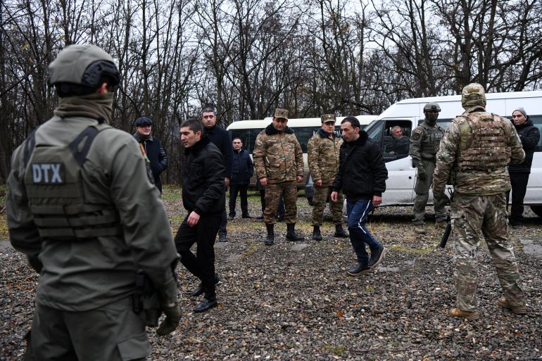 Armenian prisoners of war (POWs) are seen during a swap at the Azerbaijani-Armenian state border